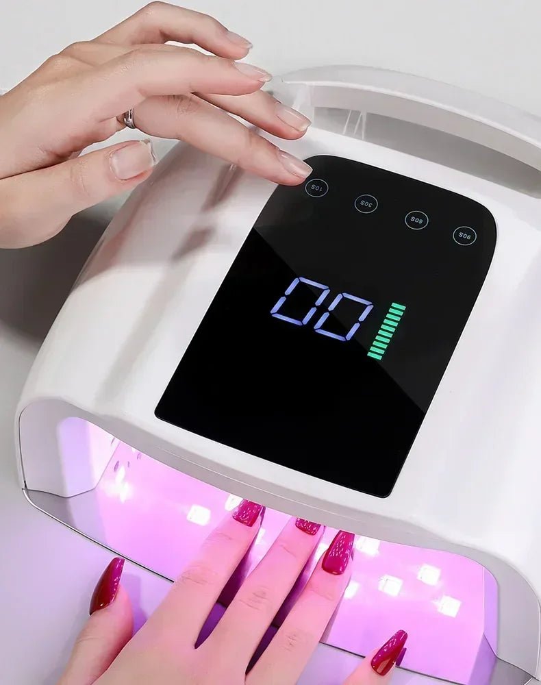 Luxury nails drying under a LED nail lamp, ideal for creating Hailey Bieber nails with nail art supplies