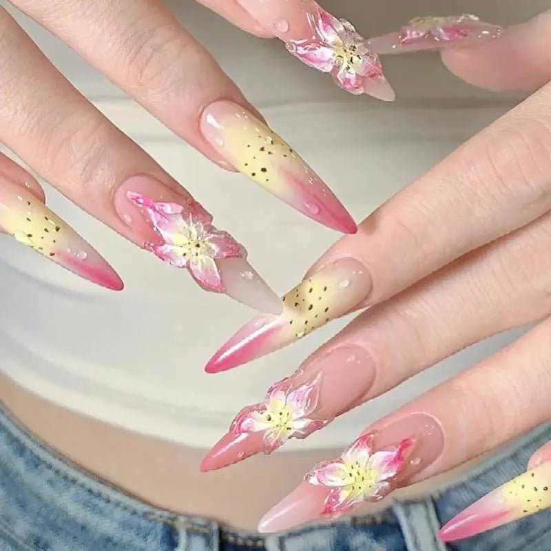 Beautiful floral nail art on long stiletto nails, perfect for nail art supplies enthusiasts