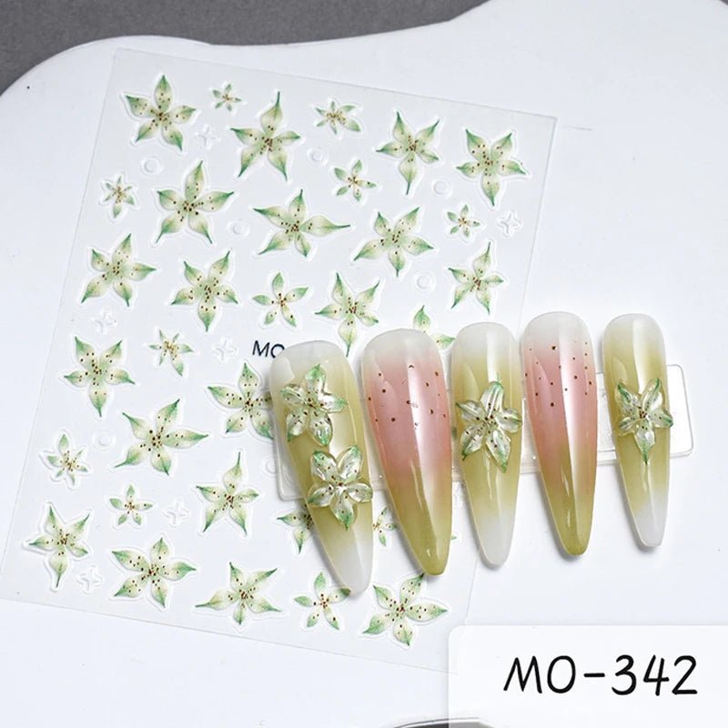 Paola Center Nail Art Supplies featuring floral designs on nail tips and sheet stickers
