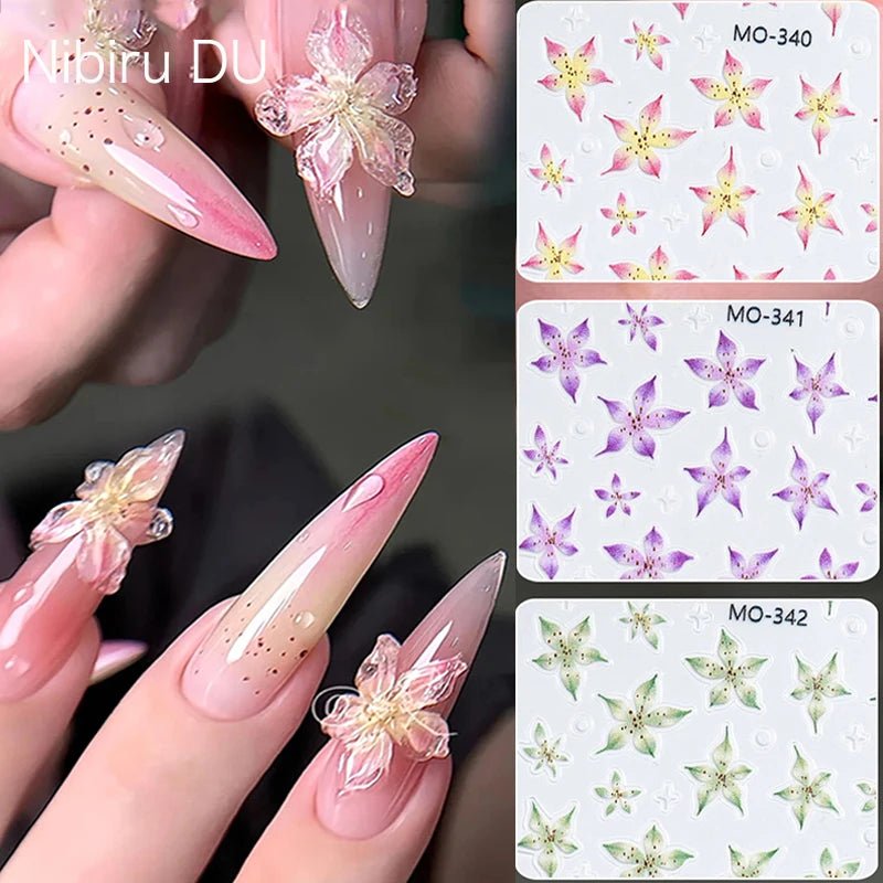 Paola Center Nail Art Supplies featuring colorful floral designs on long acrylic nails