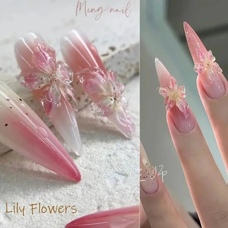 Elegant nail art supplies featuring lily flower designs on long clear nails with pink gradients