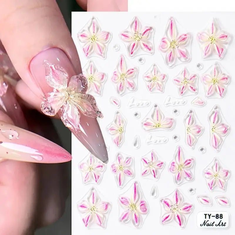 Flower nail art supplies featuring pink and white floral designs for creative nail art decor