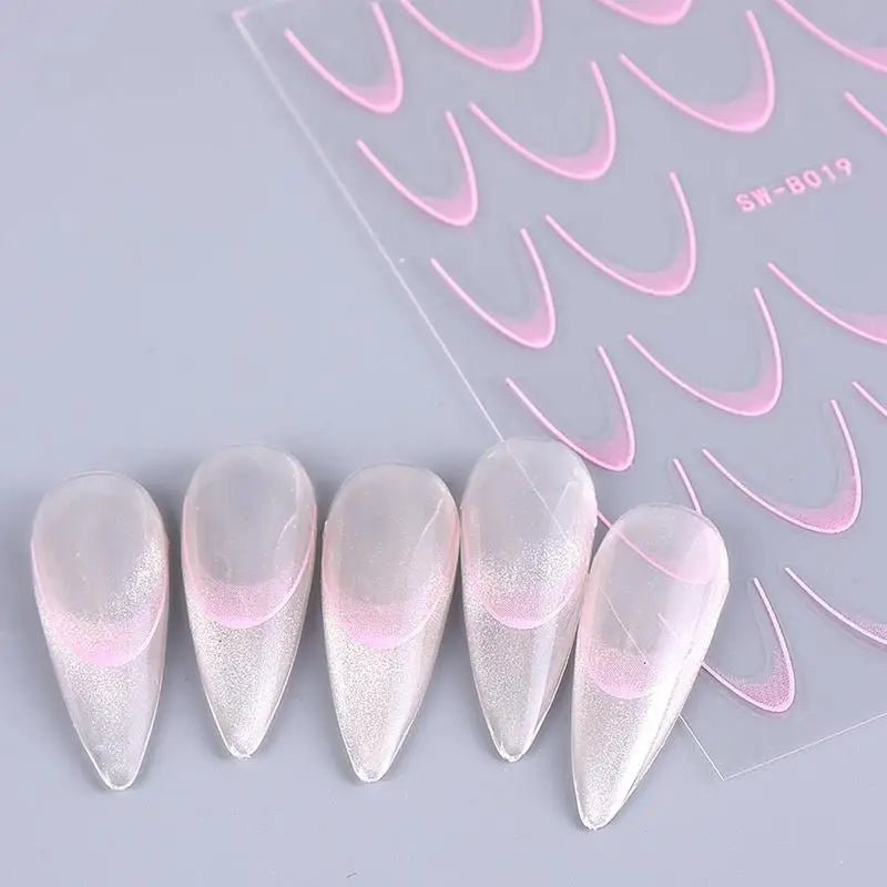 Paola Center nail art supplies featuring pink design stencils and stylish false nails