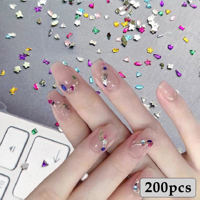 DIY luxury nail accessories set showing decorated nails with colorful rhinestones and glitter pieces