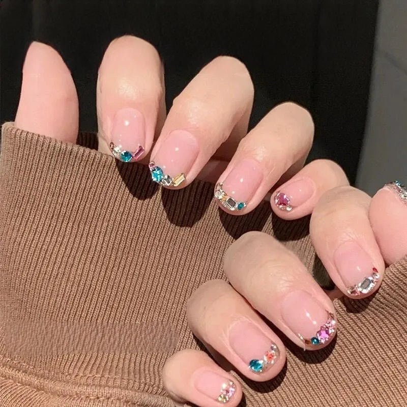 Nails decorated with colorful gems using DIY luxury nail accessories set for elegant design