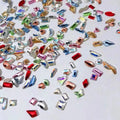 Colorful assortment of shiny gemstones for DIY luxury nail accessories set from Paola Center