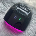 Paola Center black Gel Polish Dryer UV Light with digital display and purple curing light on fur background