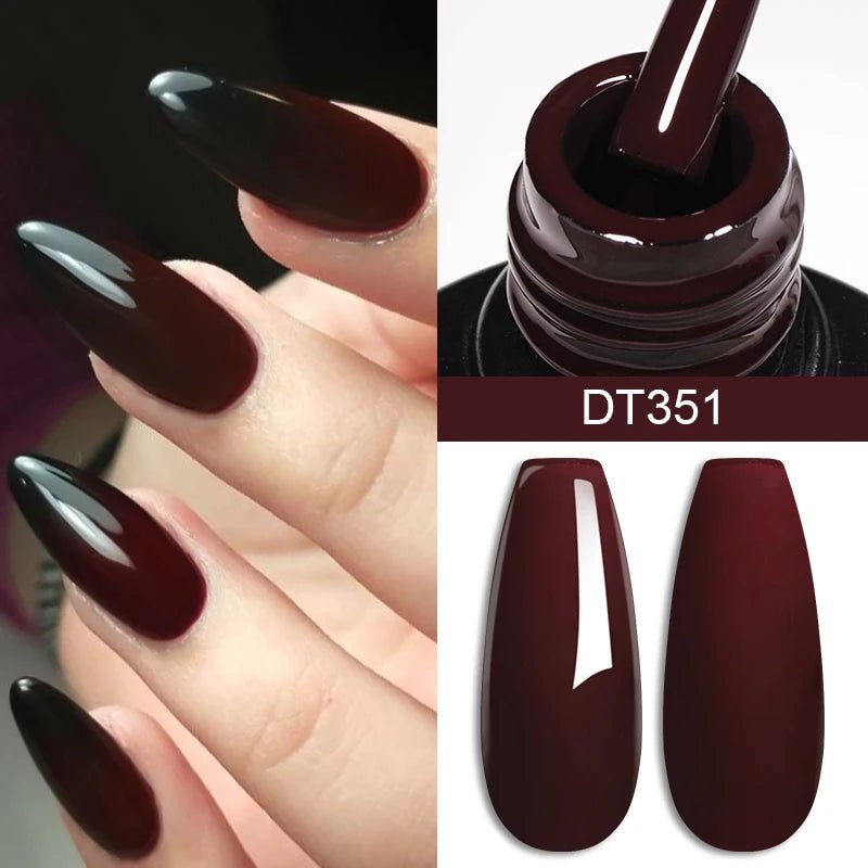 Luxury nails in dark burgundy color with glossy finish and nail art supplies for stylish manicures