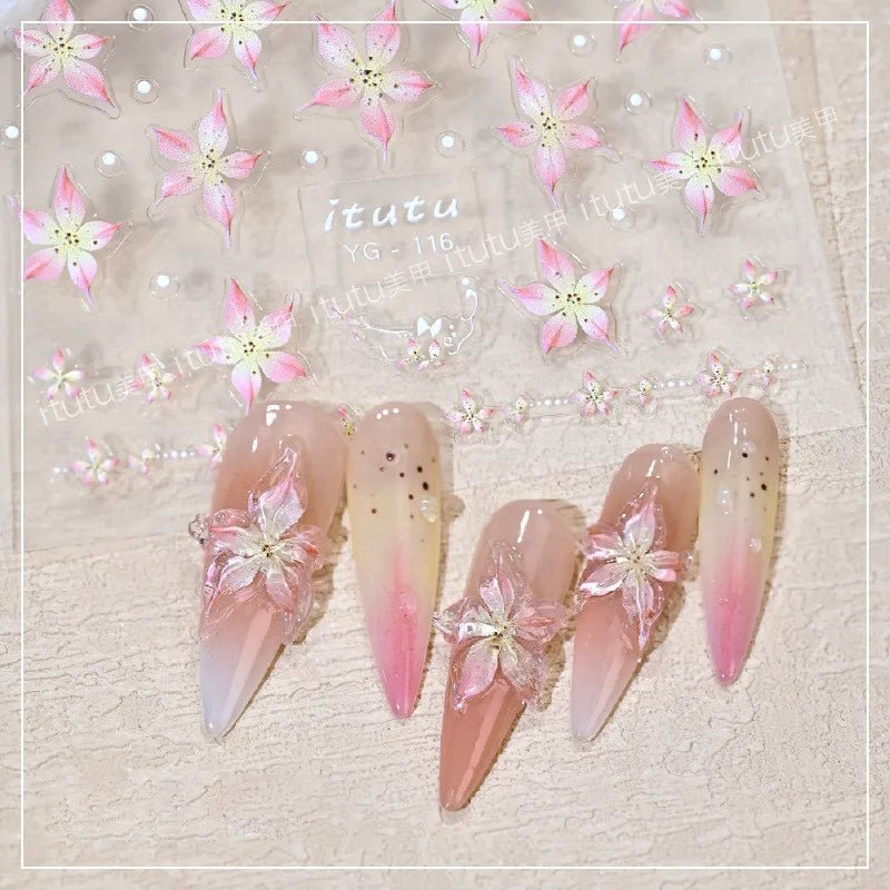 Paola Center nail art supplies featuring floral decals and beautifully designed manicure with ombre effect