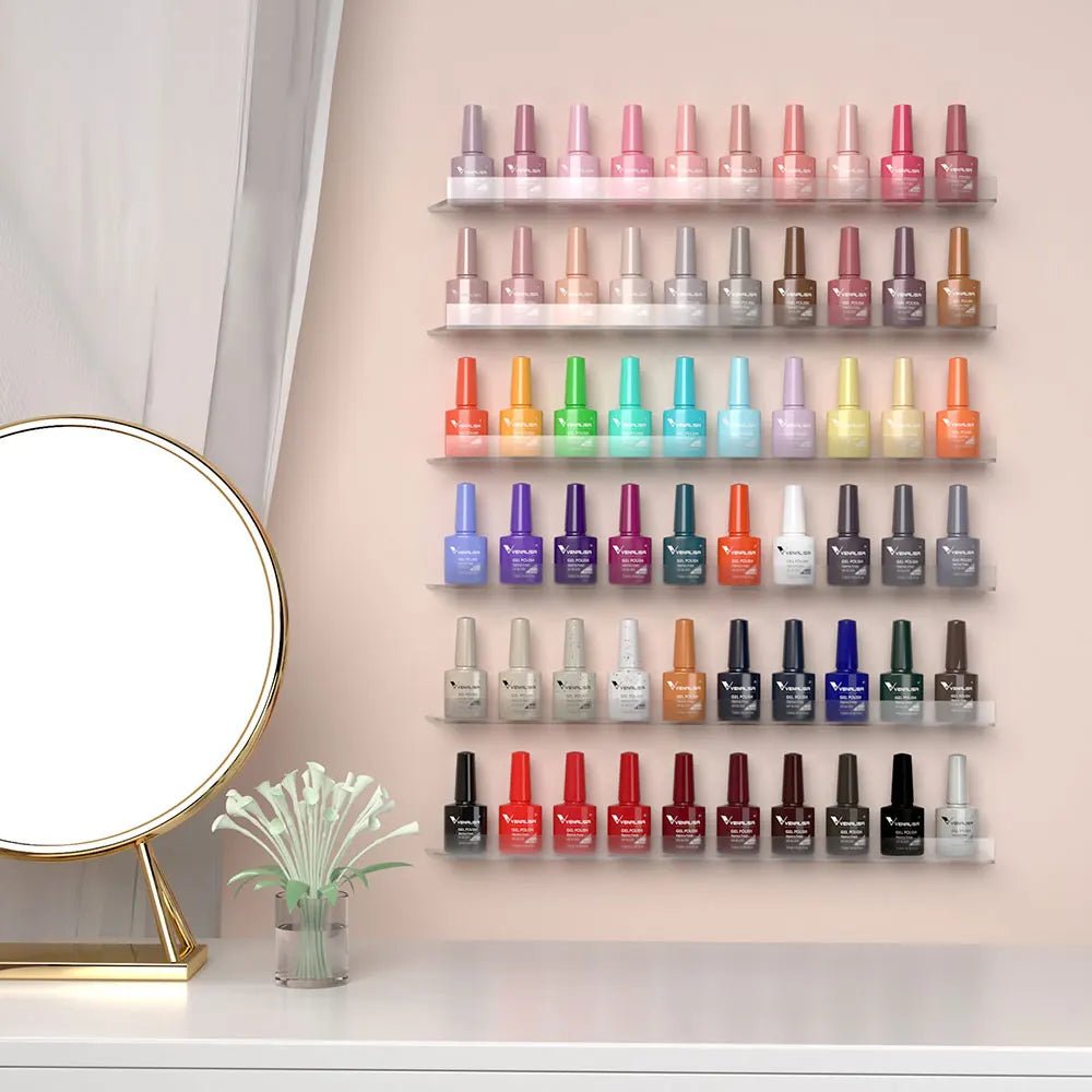 Paola Center long-lasting nail polish set with 42 colorful shades displayed on a wall above a vanity mirror and flower vase